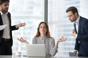 Woman all zen between two fussing men